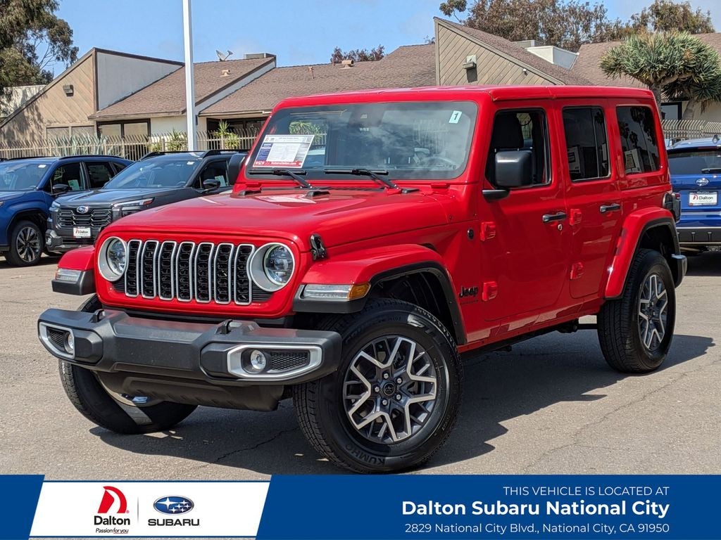 2025 Jeep Wrangler Sahara in Firecracker Red Clearcoat — front three-quarter view